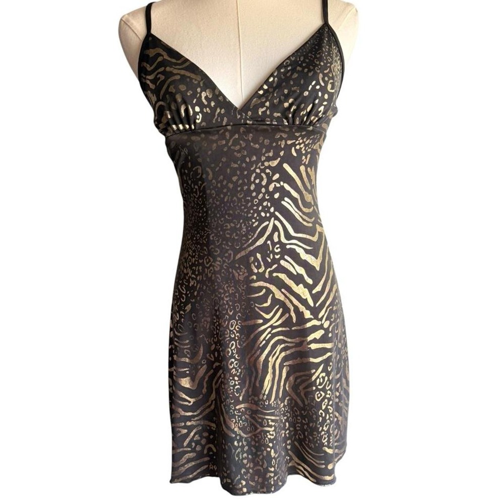 Black & gold zebra print mini dress with leopard print accents.